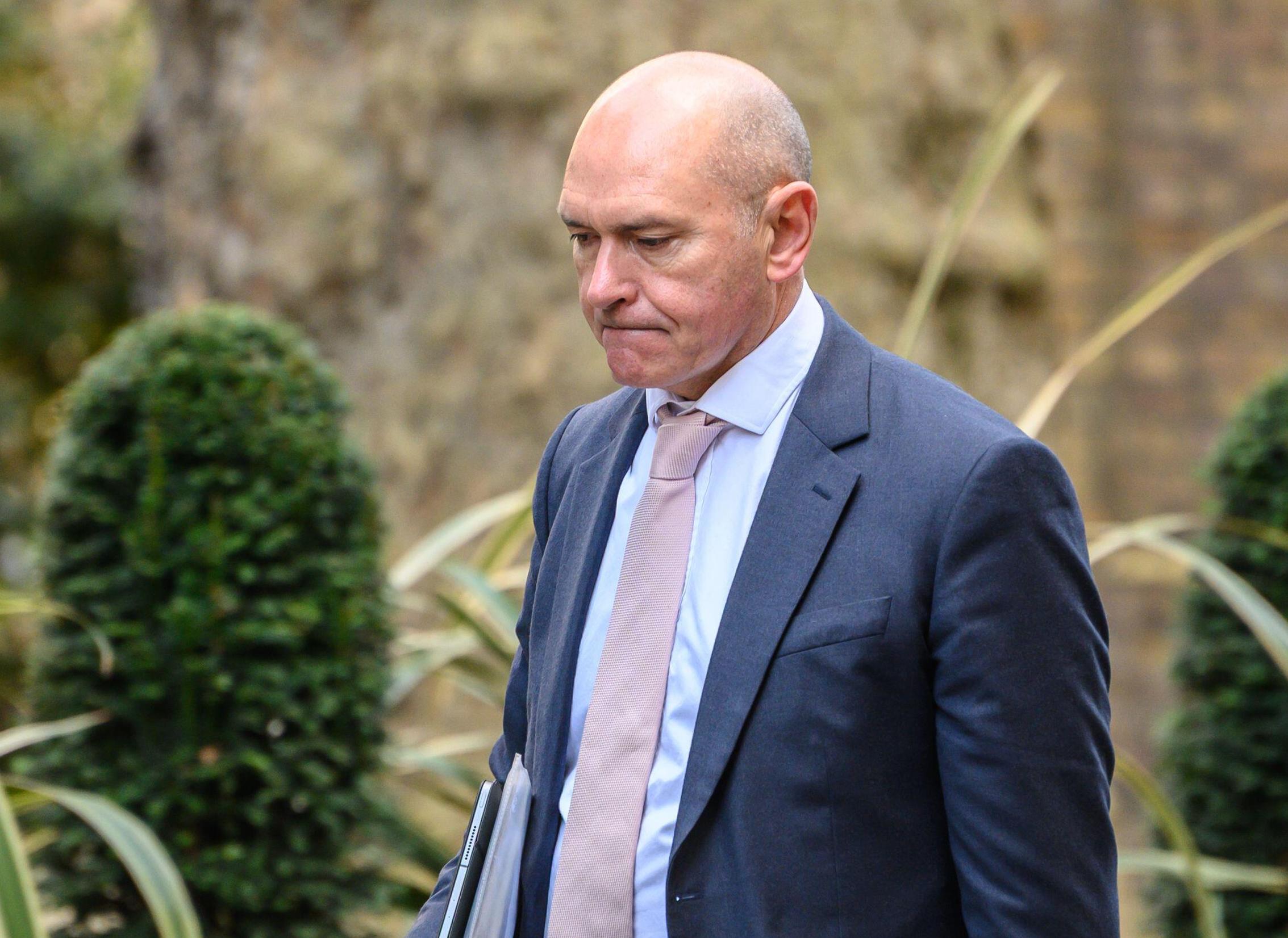 Sir James Mackey, interim CEO of NHS England, entering Downing Street for a meeting.