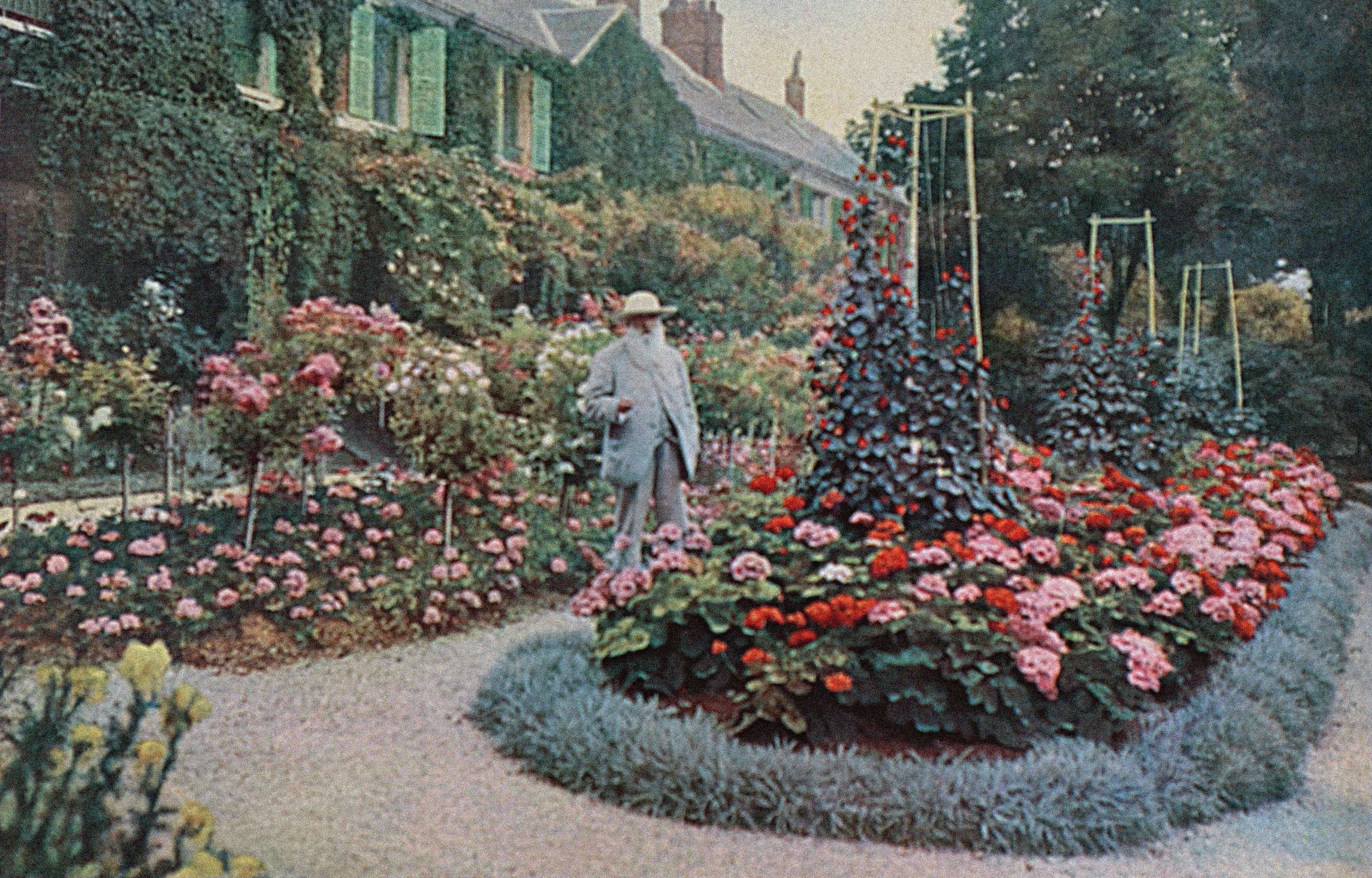 Painting of Claude Monet in the garden of his house at Giverny.