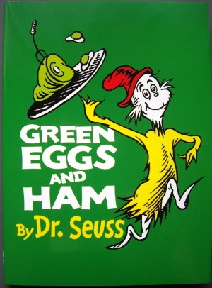Illustration of the book cover for Green Eggs and Ham by Dr. Seuss, featuring a character holding a plate with green eggs.