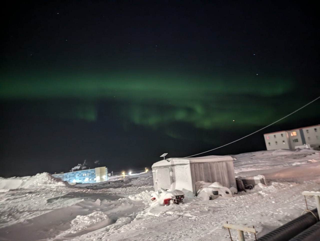 Nothern lights in snow covered Nunavut