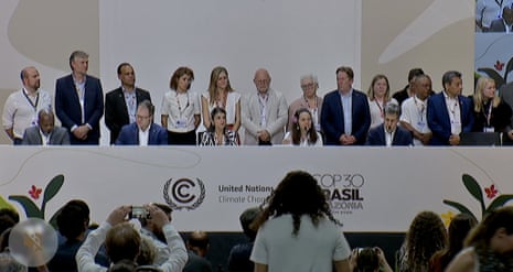 Ministers cram onto the stage to join the Mutirão call for a fossil fuel roadmap