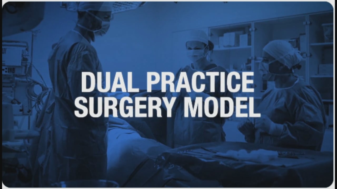 A screen grab of a video showing doctors in an operating room with "dual practice surgery model" written
