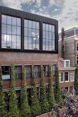 Vines were added up the side of the building. These naturally help cool down the building and on an aesthetic level, serve as a winding green beacon catching eyes at street level. For industrial buildings that aren’t often all that welcoming and are more or less categorically disconnected from nature, these interventions go a long way. 