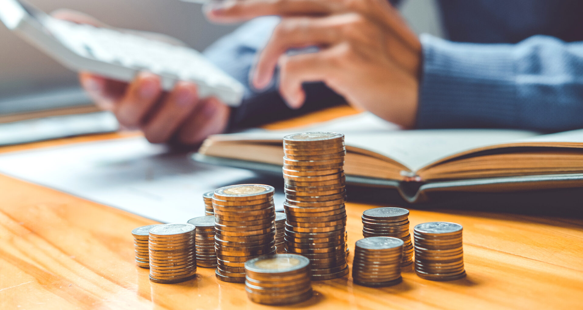 Saving money concept Man hand putting Row and coin Write Finance Saving money concept Man hand putting Row and coin Write Finance.