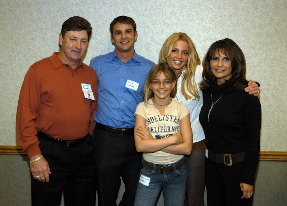 Britney Spears surrounded by her mother, brother, father, and sister, smiling