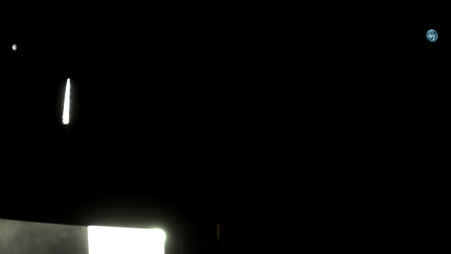 Two exposures from OSIRIS-APEX&rsquo;s StowCam instrument were used in this image of the moon, on the far left, and Earth, on the far right. Light reflects off the spacecraft&rsquo;s instruments in the foreground. OSIRIS-APEX was about 370,000 miles (595,000 kilometers) away from Earth when it captured this view on Sept. 24, 2025.