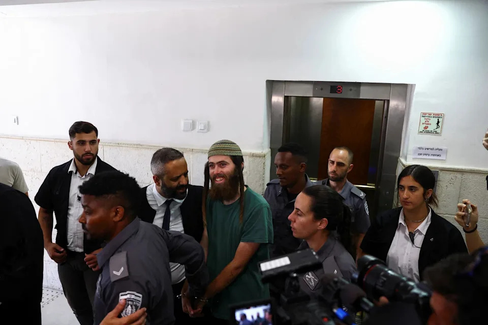 In September 2023, Elisha Yered (centre) was held by Israeli law enforcement over the August 2023 shooting of a 19-year-old Palestinian.
