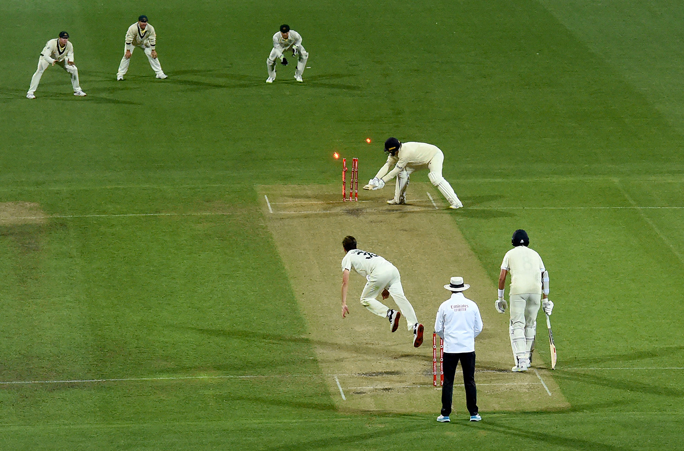 The final wicket: Ollie Robinson backs away to leg and is bowled by Pat Cummins' yorker to end the Ashes 4-0 in Australia's favour