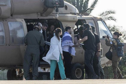 Kalfon, with his family, following his release from Hamas captivity en route to an Israeli hospital, in October.