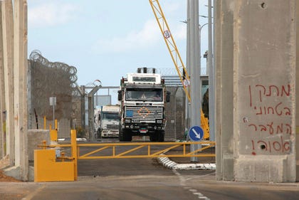 Humanitarian aid trucks entering the Gaza Strip from Egypt.