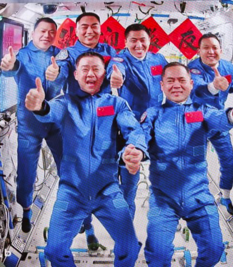 This image captured at Beijing Aerospace Control Center on Nov. 1, 2025 shows a group picture of the crew of Shenzhou-20 and Shenzhou-21 spaceships. The three astronauts aboard China's Shenzhou-21 spaceship have entered the country's space station and met with another astronaut trio early Saturday morning, starting a new round of in-orbit crew handover. The Shenzhou-20 crew opened the hatch at 4:58 a.m. (Beijing Time) and greeted the new arrivals, according to the China Manned Space Agency (CMSA). The six crew members then took group pictures for the seventh space get-together in China's aerospace history. They will live and work together for about five days to complete planned tasks and handover work, the CMSA said. (Xinhua/Jin Liwang)
