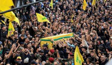 'We'll never surrender our weapons': Thousands mourn Hezbollah commander killed by Israel - Haaretz