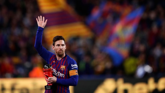Barcelona forward Lionel Messi waves at the crowd.(AP)