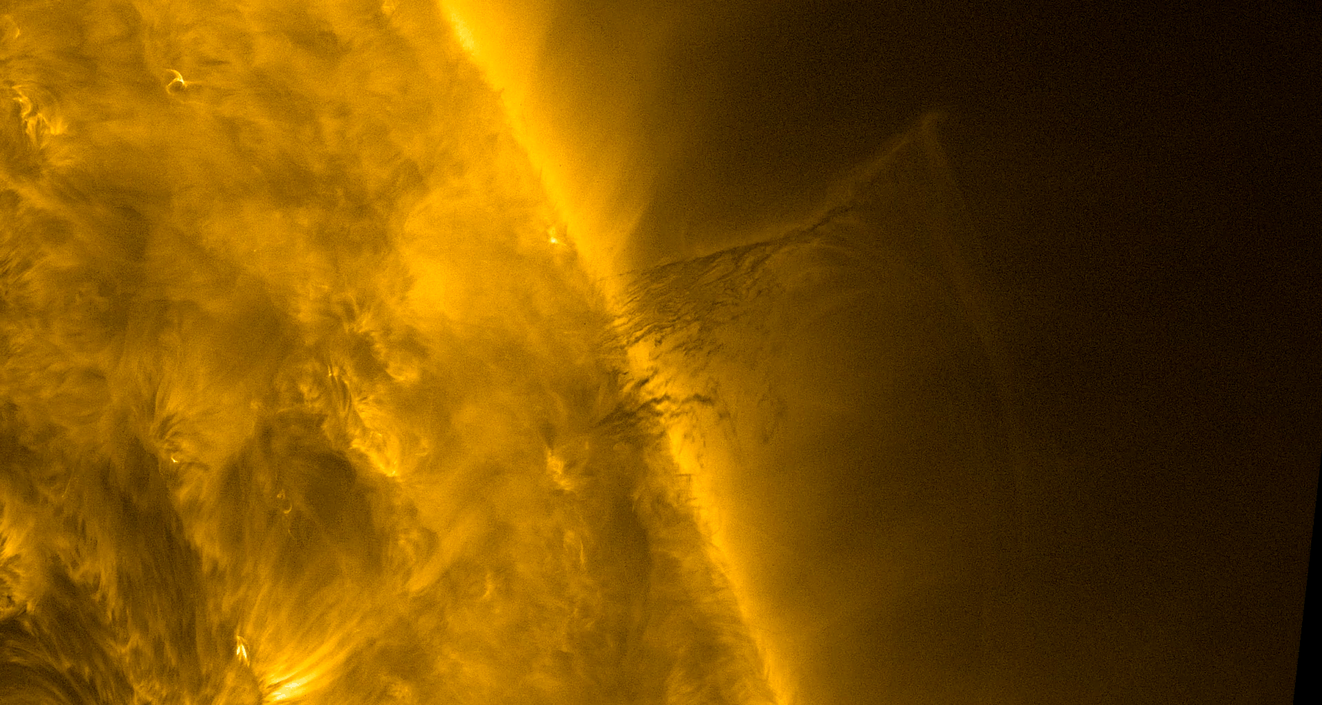 A solar prominence hovers over the Sun