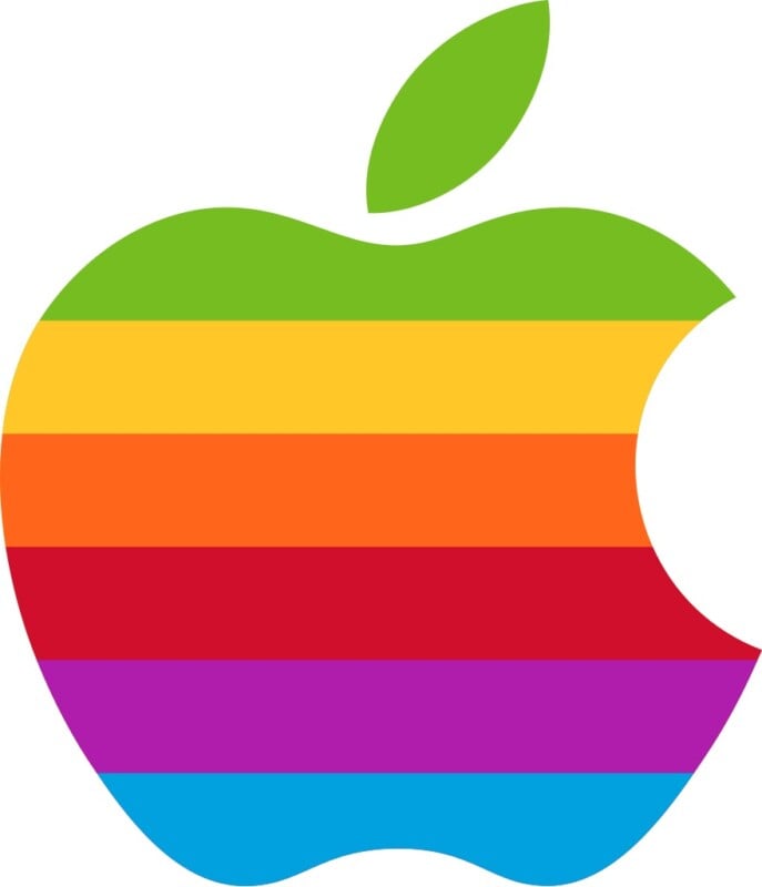 A stylized apple logo with a bite taken out of the right side, featuring horizontal stripes in green, yellow, orange, red, purple, and blue. A green leaf sits at the top.
