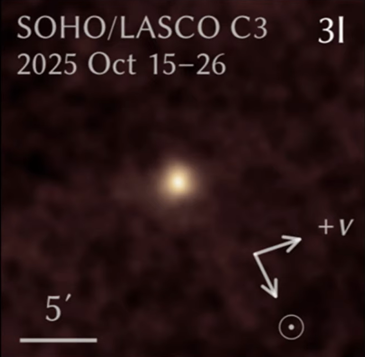 A fuzzy cream dot on a dark background with text.