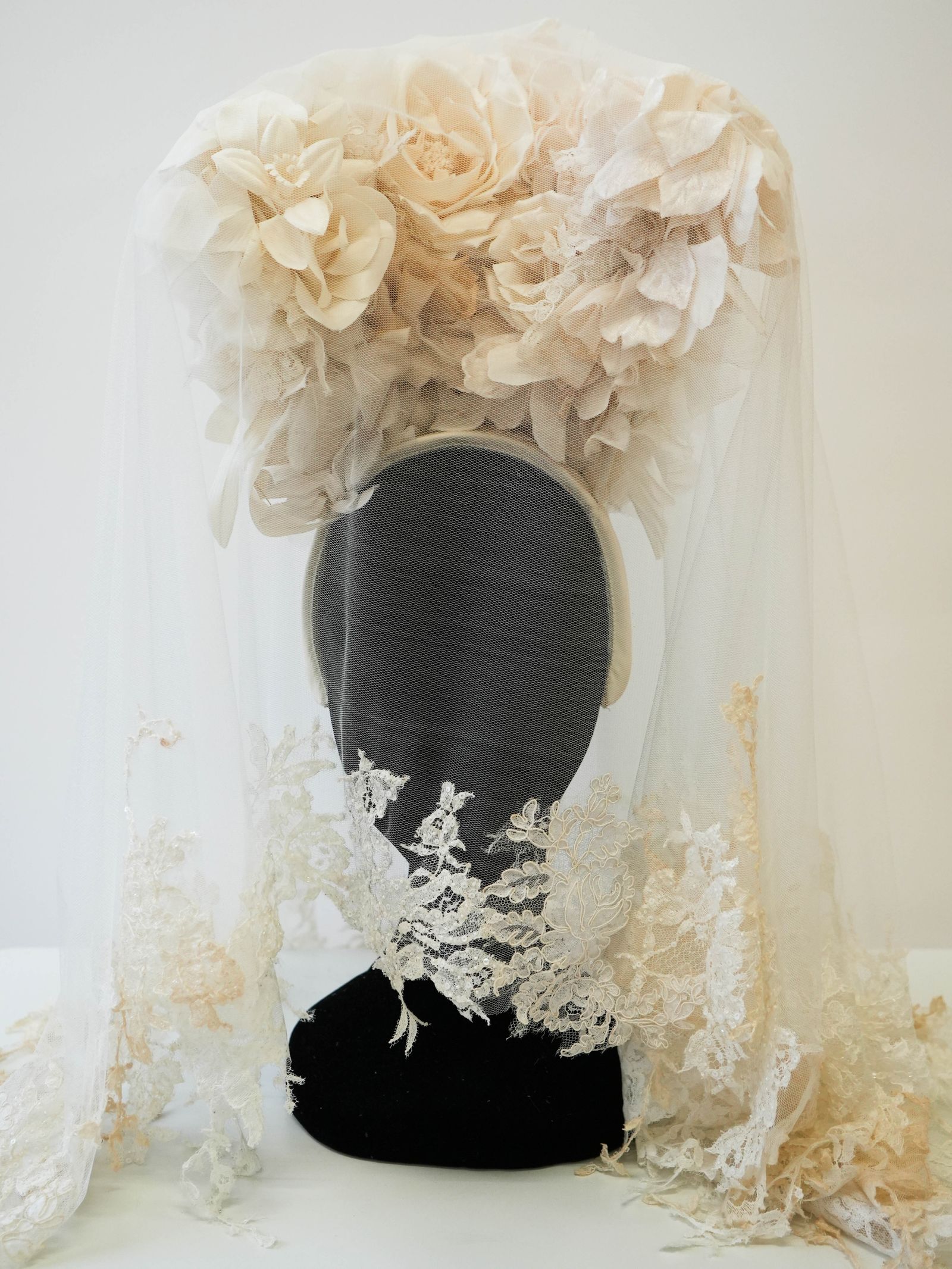 Image may contain Bridal Veil Clothing Dress Fashion Formal Wear Gown Person Wedding Wedding Gown Hair and Wig