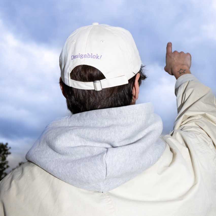 Photo of a person wearing a Designblok cap
