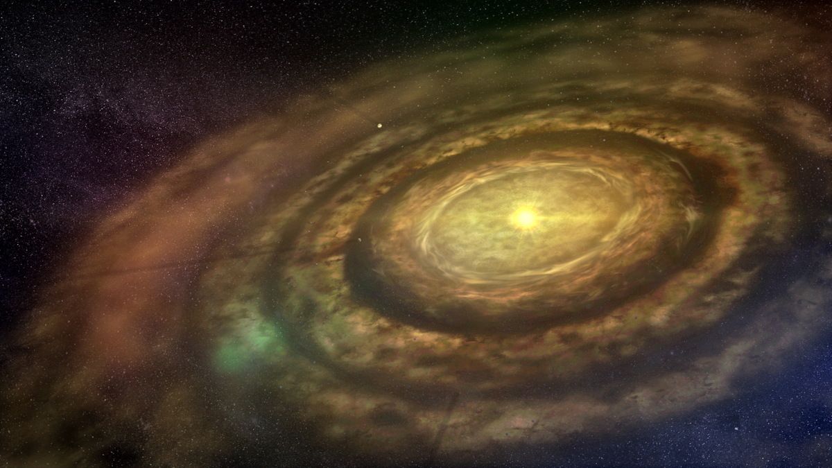 A glowing white star is surrounded by rings of gas and dust creating a protoplanetary disk