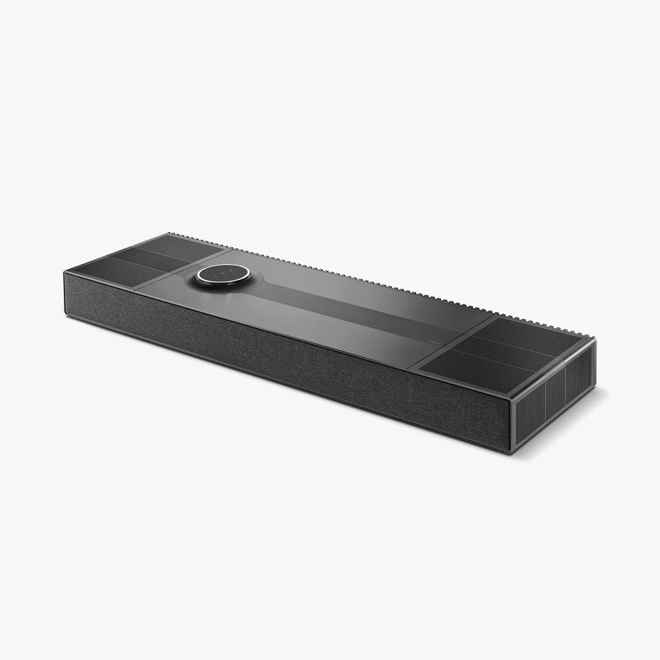 Rectangular black soundbar with fabric-covered front and circular control dial on top.