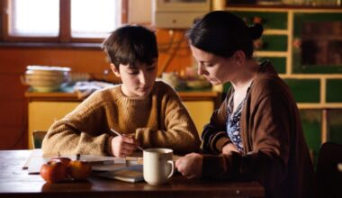 A mother helping her child with the schoolwork.