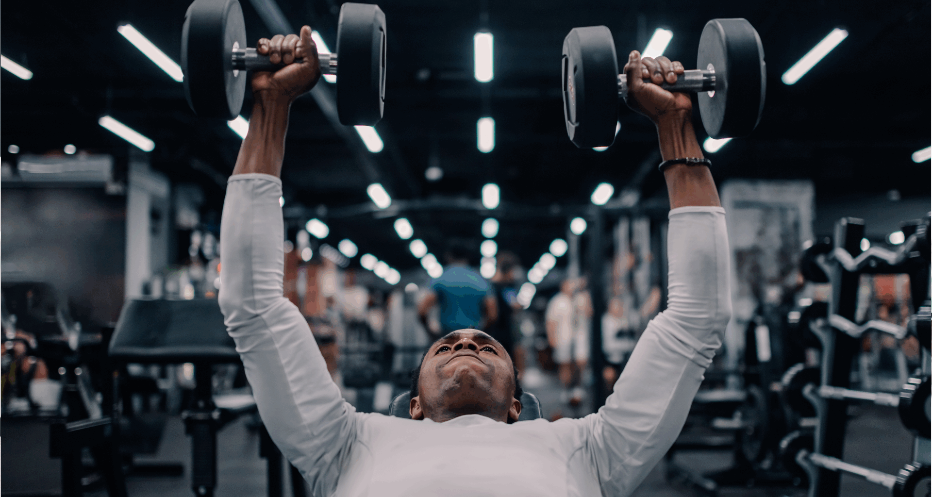 A man doing dumbbell chest press