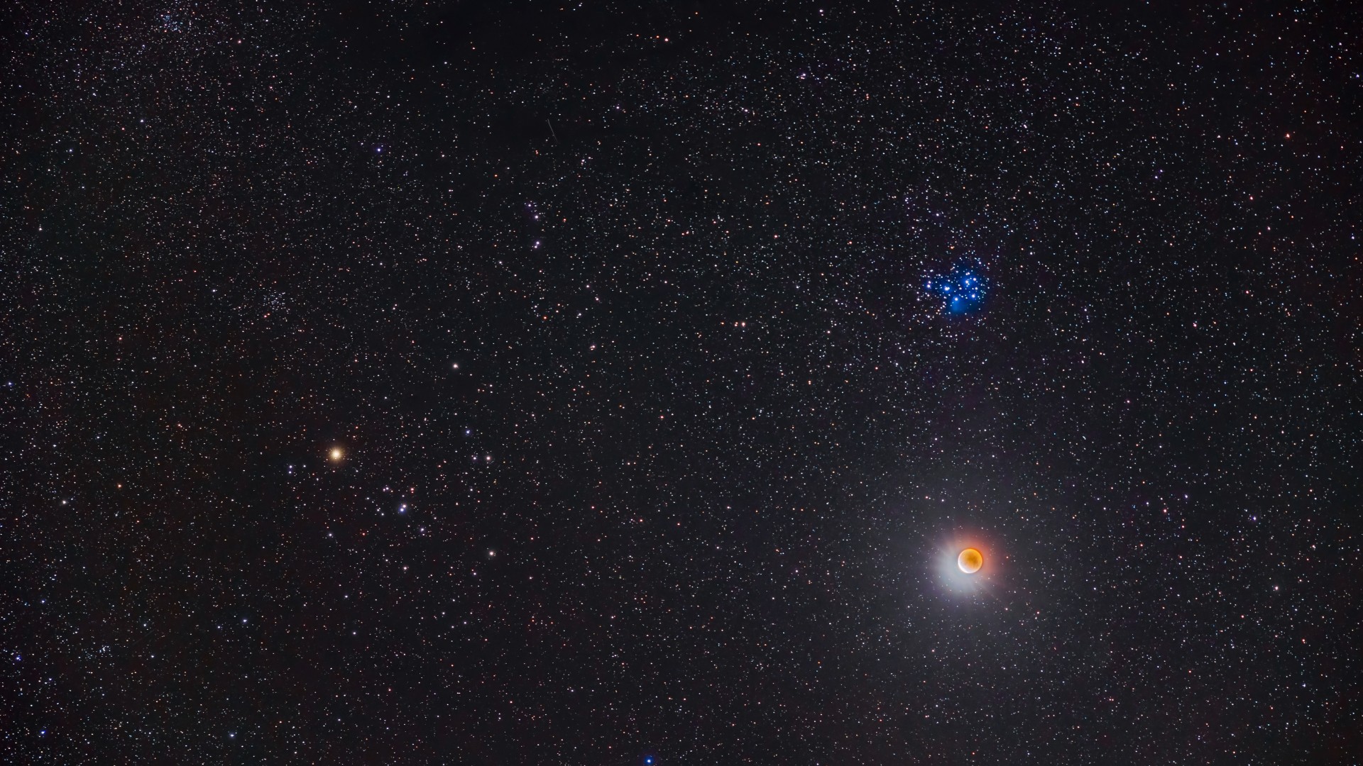 a group of blue-white stars above the moon