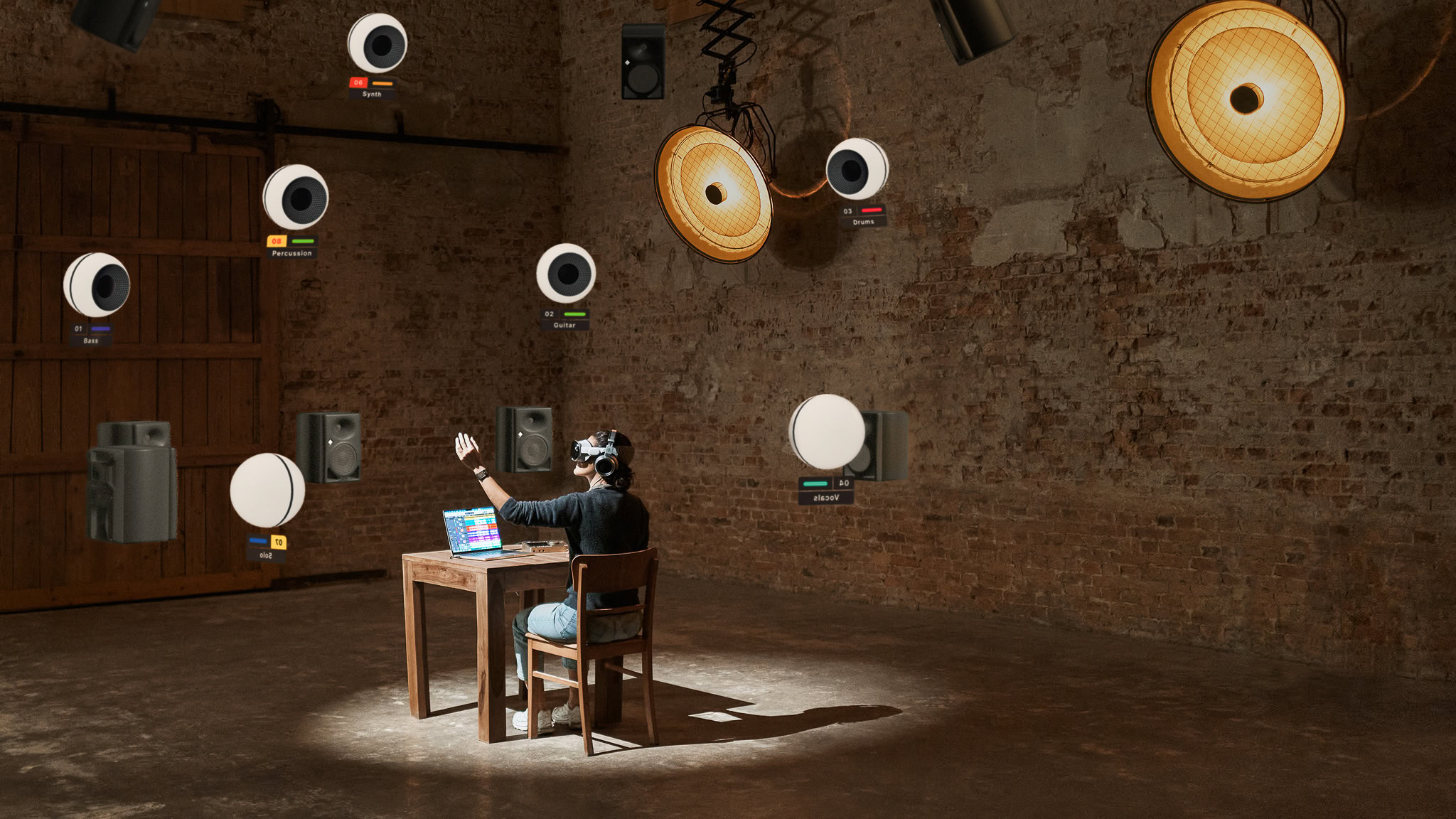 Person in a chair with a desk in front of them moving virtual objects around.