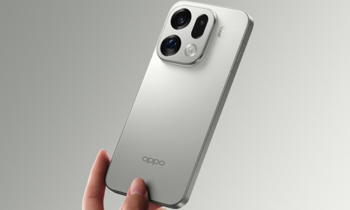 Oppo Find X9 Pro held in fingertips