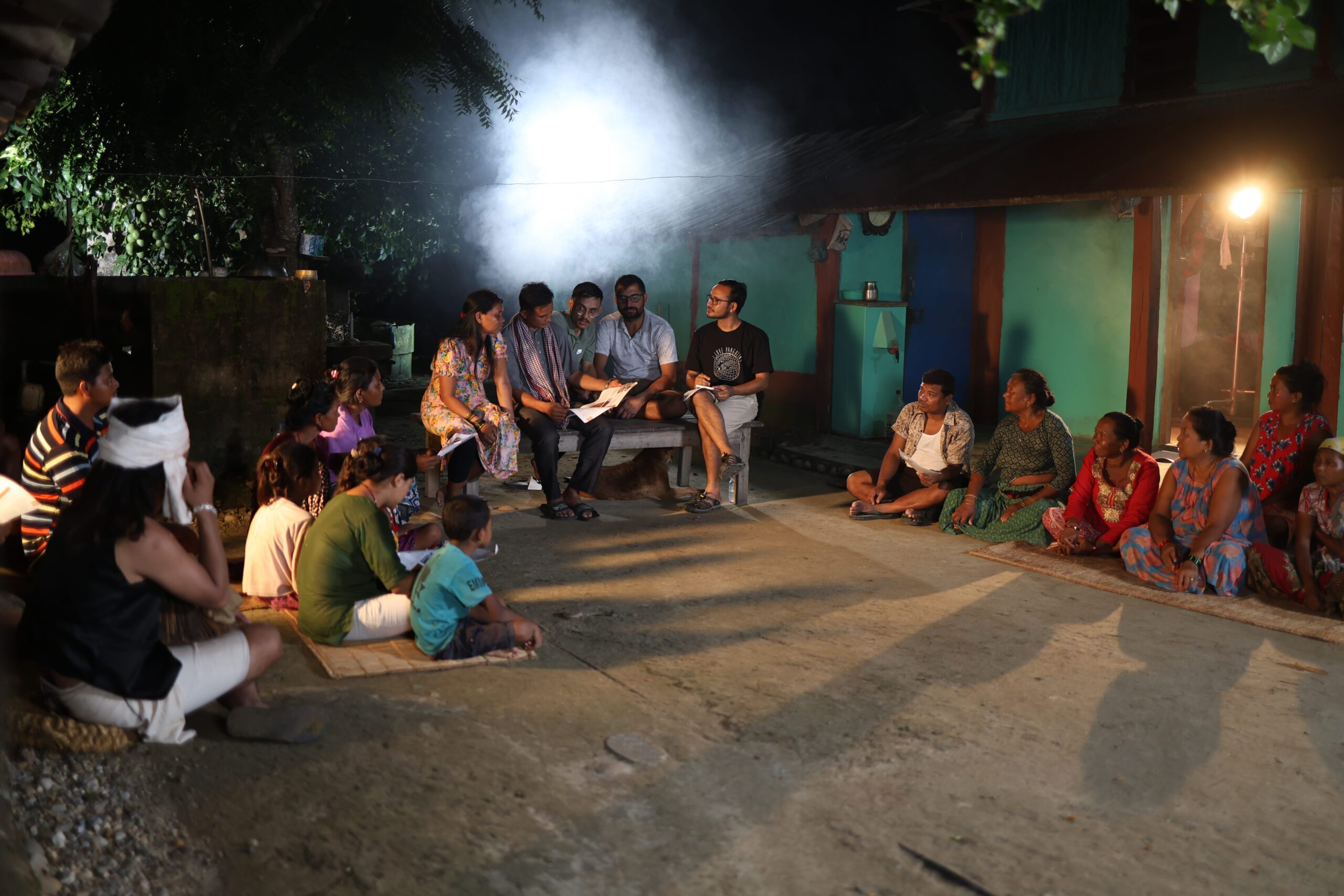 Conservationist and researcher Kumar Paudel (seated in the middle, extreme right) talks to community members about pangolins. Image courtesy of Kumar Paudel