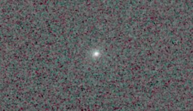 Comet 3I/ATLAS is feasible as a bright point of glowing light in the center of a pixelated black and dark grey background.