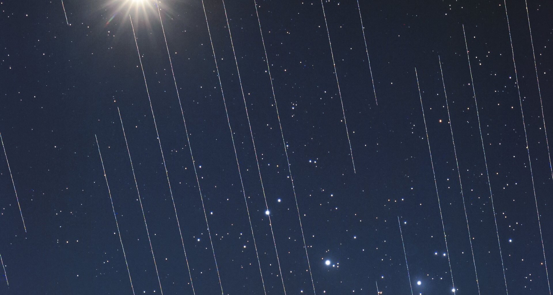 Starlink satellites moving in front of the Pleides and Venus. Credit - T. Hansen/IAU OAE/Creative Commons Attribution