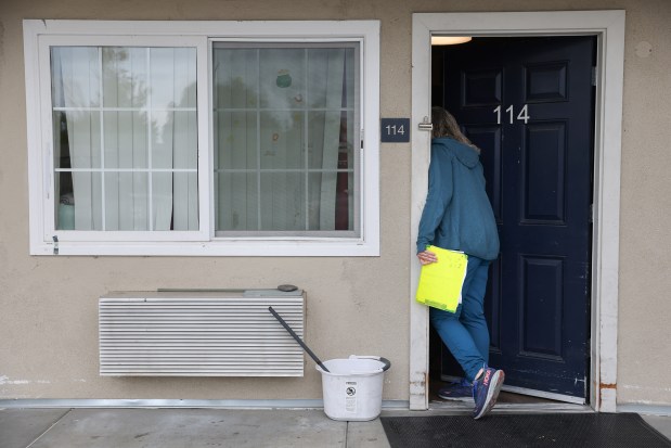 Providence Mobile Health Clinic medical assistant and patient navigator Jesika Quintal checks in on a resident at Studios at Montero supportive housing in Petaluma on Monday, Sept. 29, 2025. (Christopher Chung/The Press Democrat)