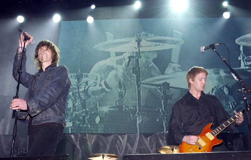 Queens of the Stone Age: Mark Lanegan on stage with Josh Homme in 2002. Photograph: L Cohen/WireImage