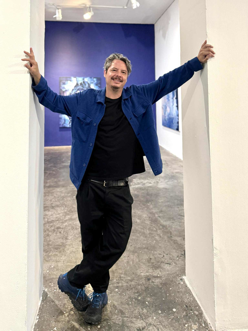 Artist Alexis Mata posing at Maia Contemporary Gallery