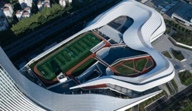 aluminum panels wrap undulating facade of sports mall by line+