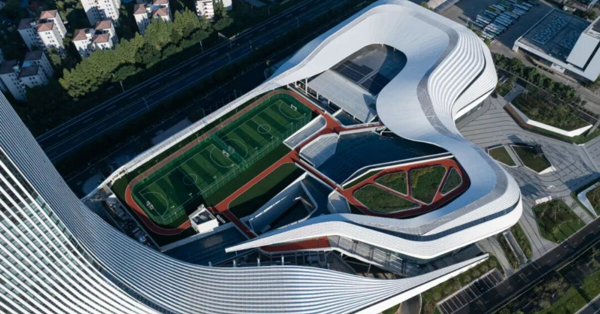 aluminum panels wrap undulating facade of sports mall by line+