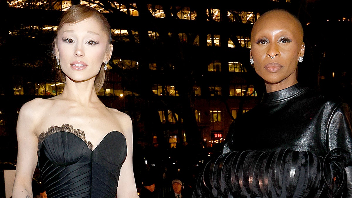 Ariana Grande and Cynthia Erivo posing for a photo together