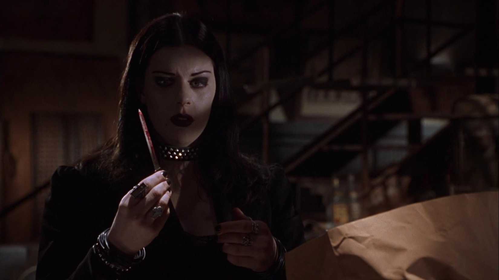 Kim cries while holding a bloody knife in Book Of Shadows Blair Witch 2