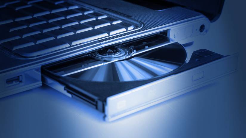 An optical disc in a laptop DVD drive.