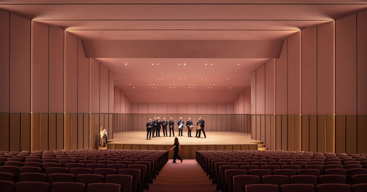 bright pink interior revitalizes sax adaptive acoustic music hall in spain