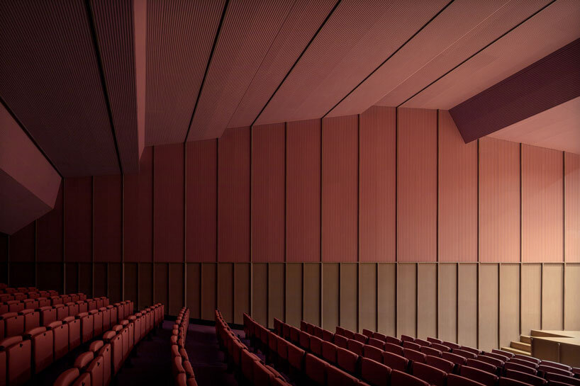 bright pink interior revitalizes adaptive acoustic music hall for sax’s cultural complex in spain