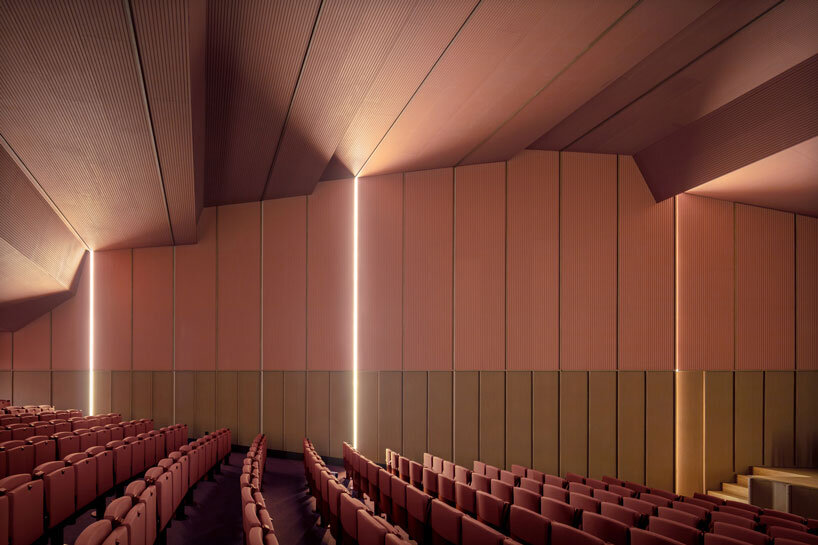 bright pink interior revitalizes adaptive acoustic music hall for sax’s cultural complex in spain