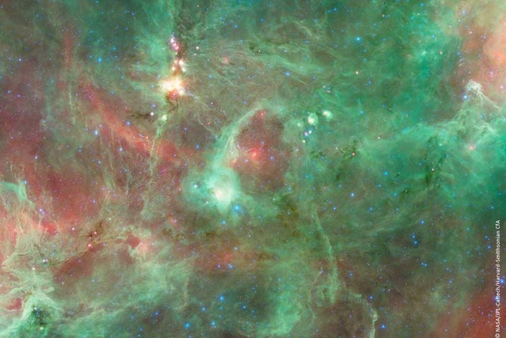 The 'Diamond Ring' structure glows brightly in infrared and is about 20 light-years in diameter. It's a bubble blown by a massive star, when its powerful stellar winds and radiation cleared the region around it. Unlike other star-blown bubbles, this one is only a slowly-expanding, flat ring. Image Credit: NASA/JPL-Caltech/Harvard-Smithsonian CfA