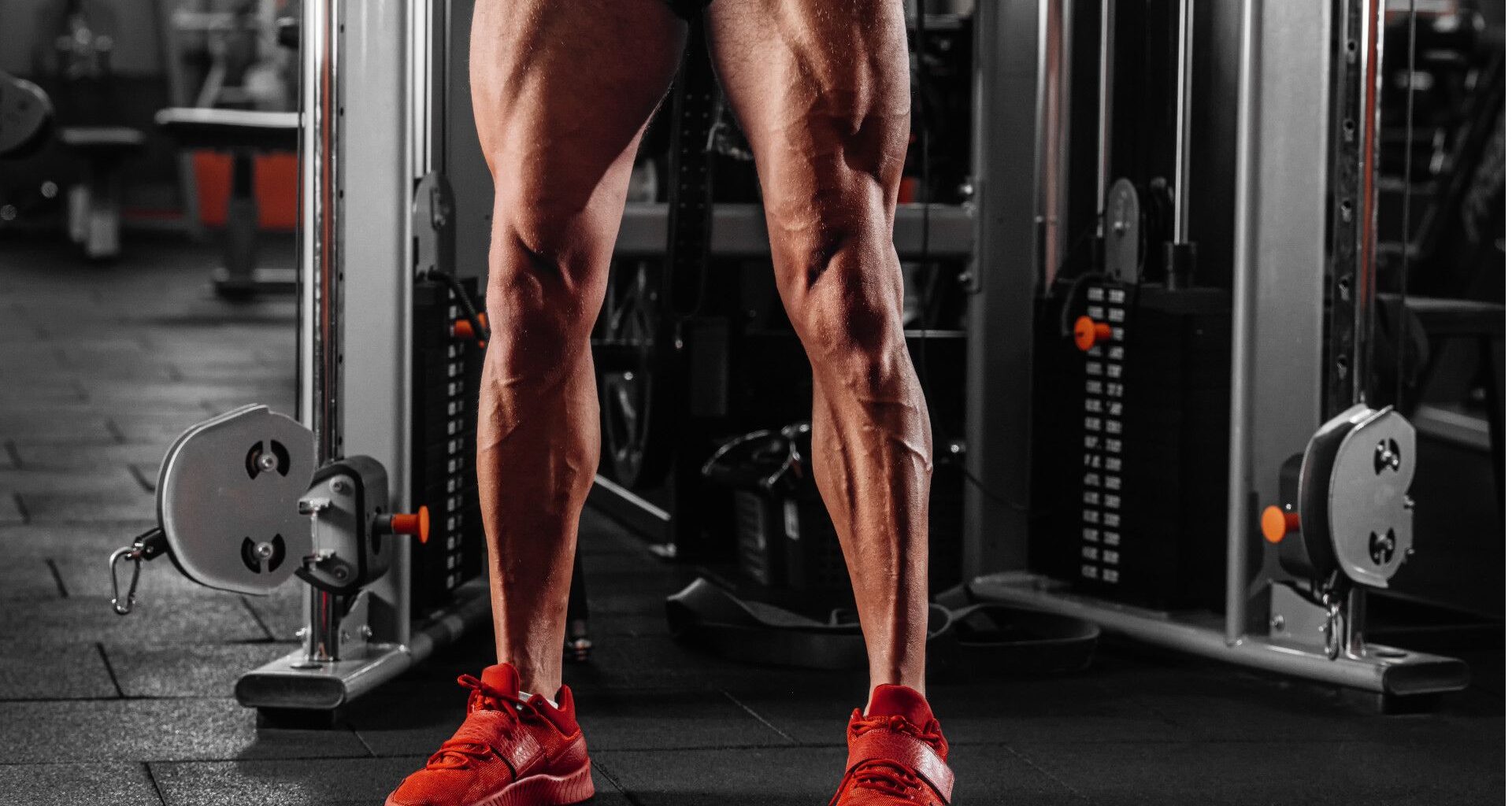 A man standing in the gym with muscular quads