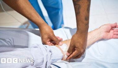 Hospital staff get four years back pay and promotions in new deal