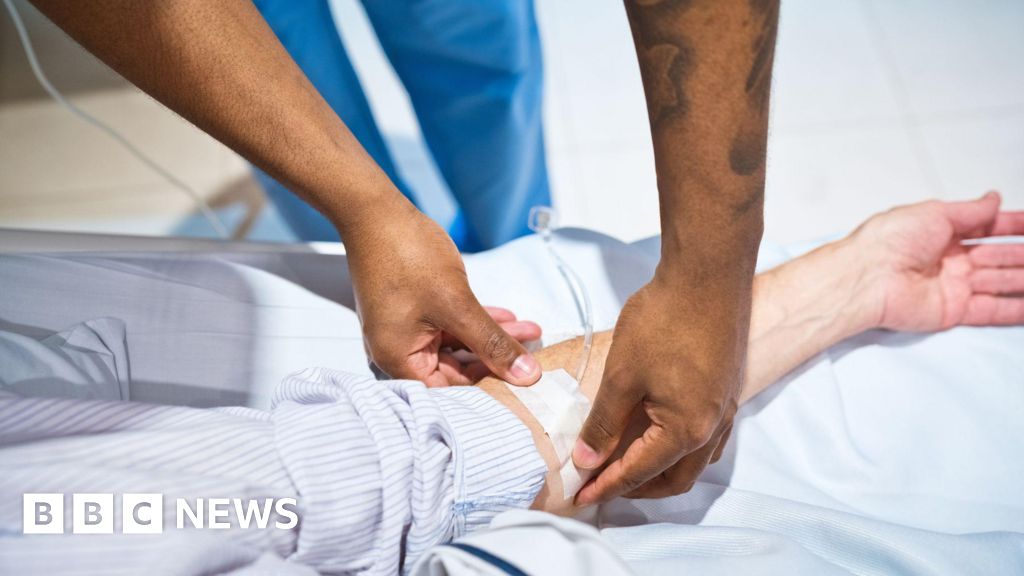 Hospital staff get four years back pay and promotions in new deal