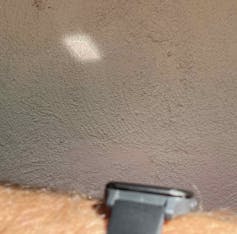 Sunlight reflected off a watch.