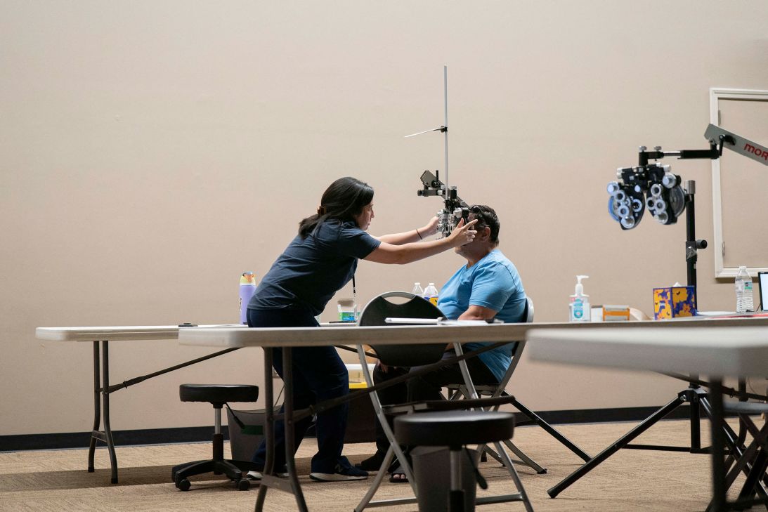 A patient is seen at the free  health clinic at the Asheville Foster Seventh-day Adventist Church in Asheville, North Carolina, on June 27.