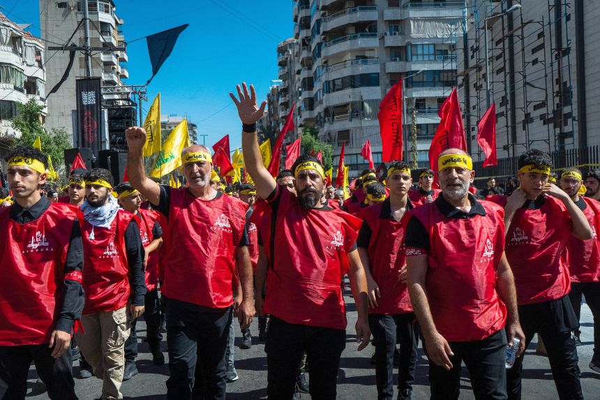 Shia Muslim worshipers, the single largest sect in Lebanon gather with Hezbollah flags in the capital, Beirut, on July 6 to mark the holy day of Ashura.
